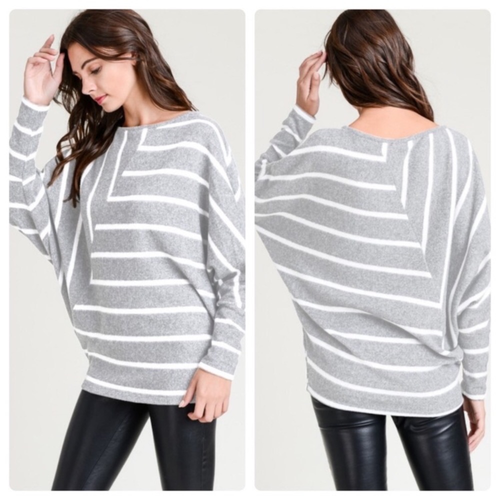 Striped gray and white top with boat neck and long sleeves.